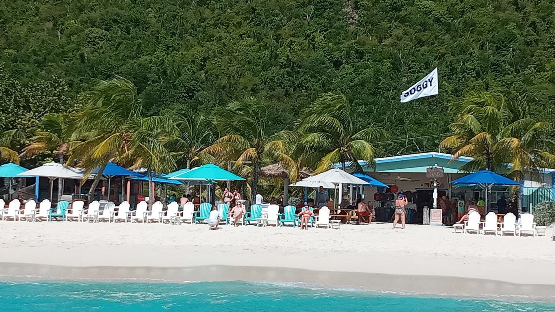 A Crowd Of People At A Beach